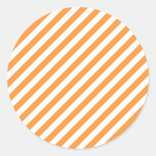 Diagonal orange and white stripes pattern classic round sticker