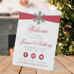 Diamante Snowflake & Red Ribbon Winter Wedding Pedestal Sign<br><div class="desc">The diamanté snowflake & red ribbon wedding collection is perfect for any couple planning a romantic winter wedding celebration. The design features a light silvery grey and white snowflake textured background with a diamanté snowflake on top of a silky looking ribbon. The wording incorporates the same silvery grey and red...</div>