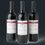 Diamante Snowflake & Red Ribbon Winter Wedding Wine Label<br><div class="desc">The diamante snowflake & red ribbon wedding collection is perfect for any couple planning a romantic winter wedding celebration. The design features a light silvery grey and white snowflake textured background with a diamante snowflake on top of a silky looking ribbon. The wording incorporates the same silvery grey and red...</div>