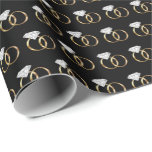 Diamond Wedding Rings Black Gold Wrapping Paper<br><div class="desc">This wrapping paper features an illustration of a pair of diamond wedding rings with a gold band arranged into a cute pattern on black paper. Perfect to wrap engagement or wedding gifts!</div>