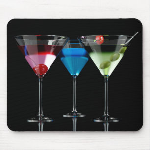Different cocktails in martini glasses on black mouse mat