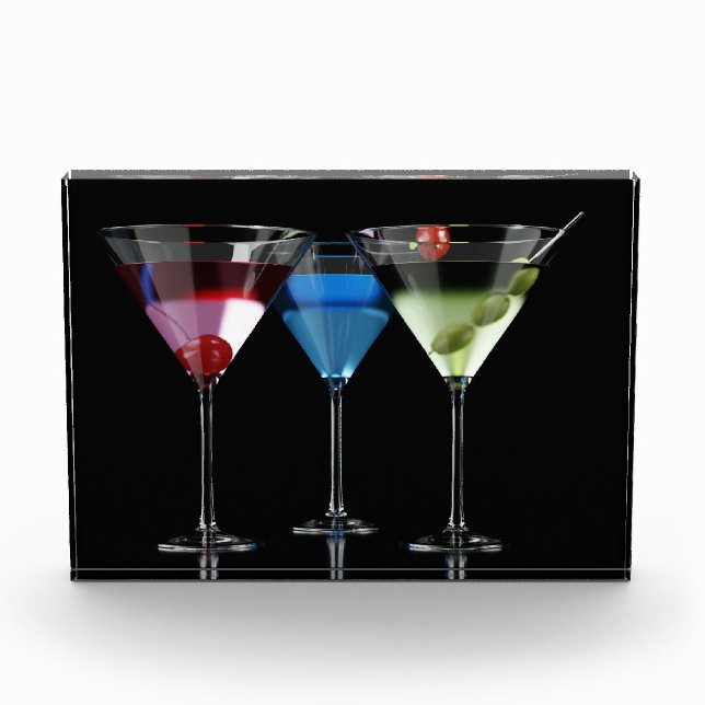 Different cocktails in martini glasses on black photo block (Front)