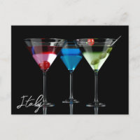 Different cocktails in martini glasses on black