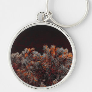 Digital art of pine tree with orange colour spots key ring