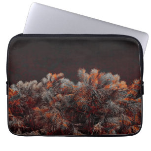 Digital art of pine tree with orange colour spots laptop sleeve
