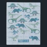 Dinosaur Blue Personalised Jigsaw Puzzle<br><div class="desc">Lots of blue dinosaurs,  Tyrannosaurus rex,  Spinosaurus,  Stegosaurus,  Diplodocus and Triceratops on a mid blue background.  Change the name to personalise.</div>