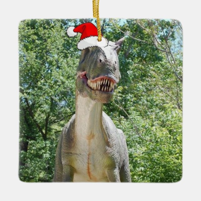 Dinosaur wearing a Santa Claus Hat for Christmas Ceramic Ornament (Front)