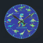 Dinosaurs with names Personalised blue green Round Clock<br><div class="desc">Add your child’s name to this fun 12 Dinosaurs in colourful psychedelic bright colours with their dino names with blue and teal green colour theme. The perfect educational design for the child who loves dinosaurs. This fun palaeontology pattern includes all the prehistoric jurassic era favourites including T. rex or tyrannosaurus,...</div>