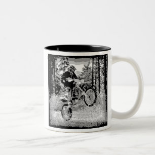Dirt bike wheeling in the woods Two-Tone coffee mug