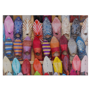 Displayed shoes in a shop in the souks cutting board