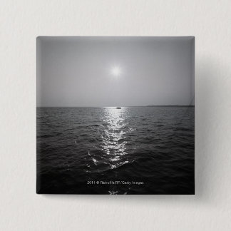 Distant boat on ocean 15 cm square badge