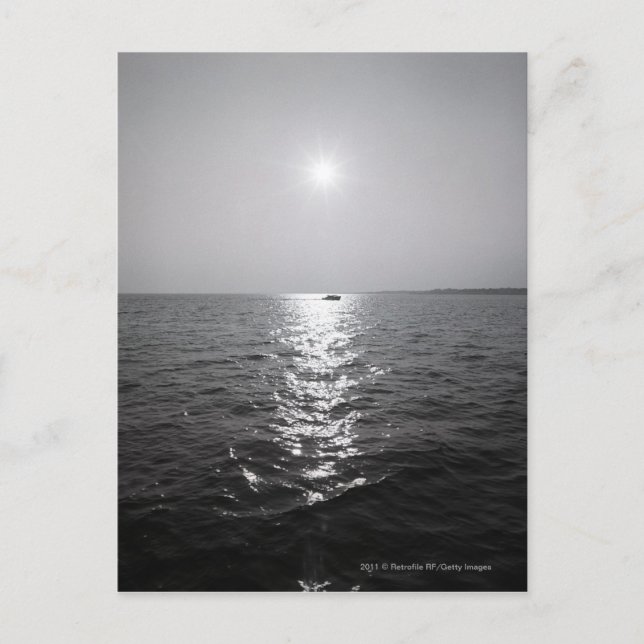 Distant boat on ocean postcard (Front)