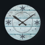 Distressed Blue Beach Wood Starfish Photo Round Clock<br><div class="desc">Distressed beach wood in blue with midnight blue starfish representing the clock number with your favourite photo. Makes a great house warming gift or decor for your beach house. If you have any questions about the "DESIGN ONLY" or need help please message me or visit my store link: https://www.zazzle.com/store/jmr_designs (Copy...</div>