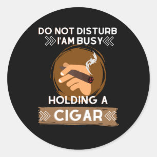Do not Disturb I am busy holding a Cigar Classic Round Sticker