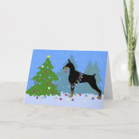 Doberman Decorating Tree in the Forest