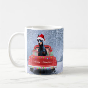Doberman Dog in Snow sitting in Christmas Truck  Coffee Mug
