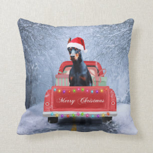 Doberman Dog in Snow sitting in Christmas Truck Cushion