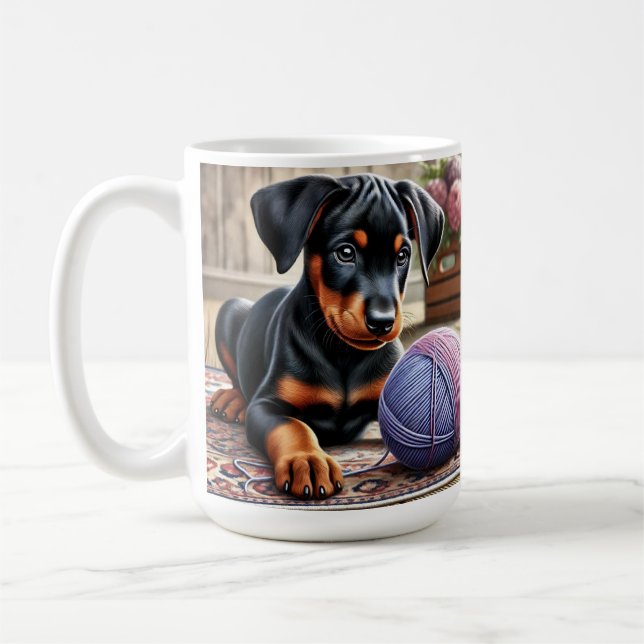 Doberman Puppy with Yarn Ball on a Colourful Rug Coffee Mug (Left)