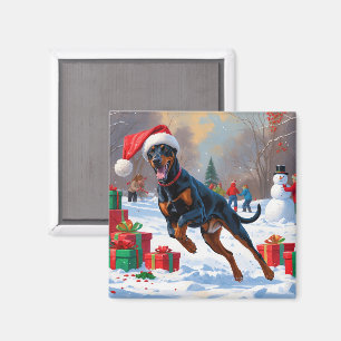 Doberman Running in Snow with Christmas Hat Magnet