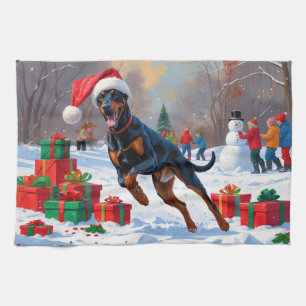 Doberman Running in Snow with Christmas Hat Tea Towel