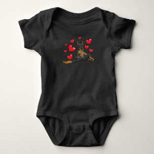 Doberman with stuffed animal baby bodysuit
