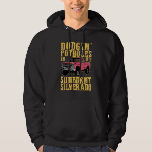 Dodging Potholes In My Sunburnt Sand In My Boots Hoodie