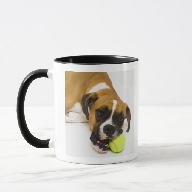 Dog biting tennis ball mug (Left)