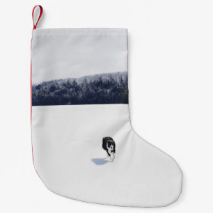 DOG ON A SNOWY PLAIN SMALL CHRISTMAS STOCKING