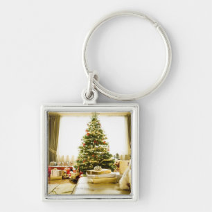 dog posing in front of Christmas tree Key Ring