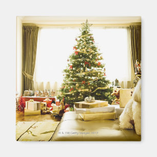 dog posing in front of Christmas tree Magnet