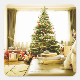 dog posing in front of Christmas tree Square Sticker