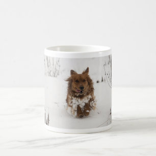 Dog running in the snow coffee mug