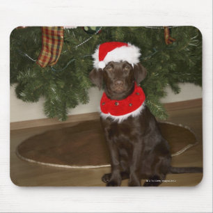 Dog sitting by a Christmas tree Mouse Mat