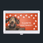 Dog Walker Paw Prints Business Card Holder<br><div class="desc">This business card holder,  personalised with your name,  features a cute Dachshund on bright orange with a white paw print border. Fun as a gift or a great way to carry your own business cards.</div>