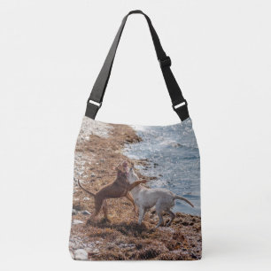 Dogs on beach crossbody bag