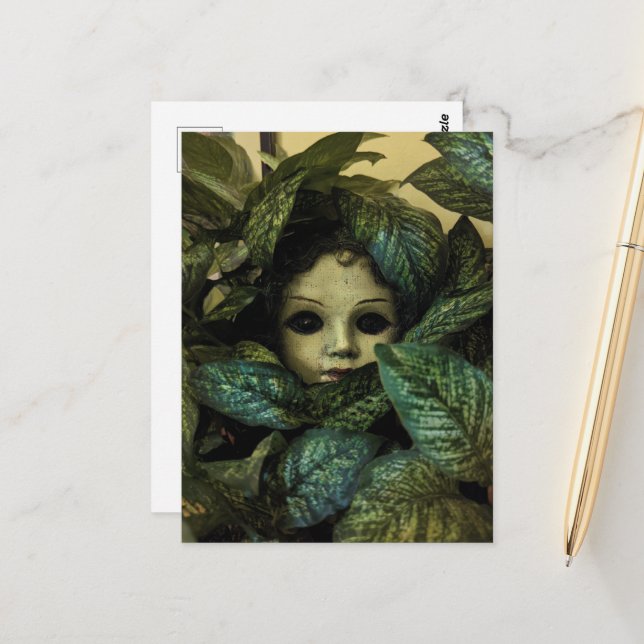 Doll Head in Plants Postcard (Front/Back In Situ)