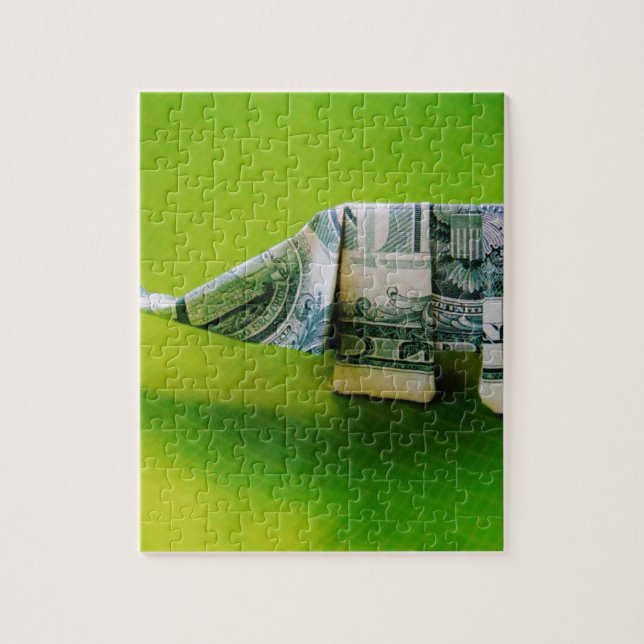 Dollar bill origami Elephant on Green background Jigsaw Puzzle (Vertical)