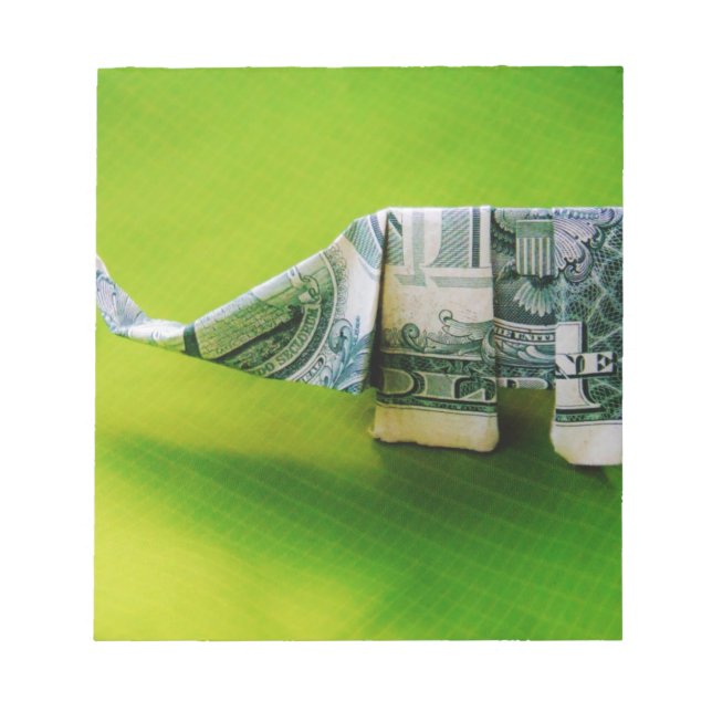 Dollar bill origami Elephant on Green background Notepad (Front)