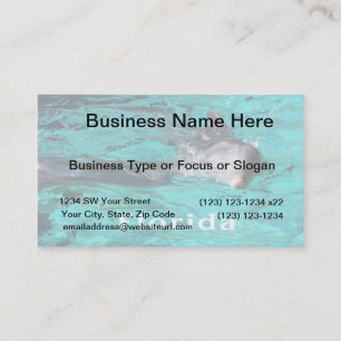 dolphin coming out of teal clear water florida.jpg business card