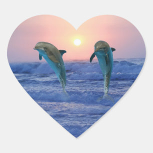 Dolphins at sunrise heart sticker