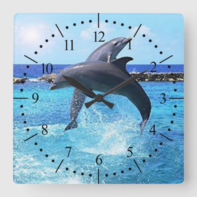 Dolphins dancing in the ocean square wall clock (Front)
