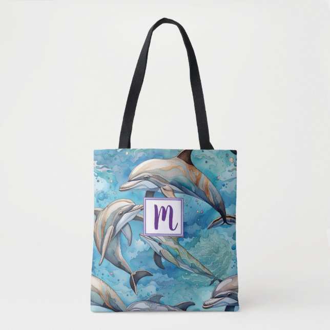 Dolphins swimming in the sea  tote bag (Front)