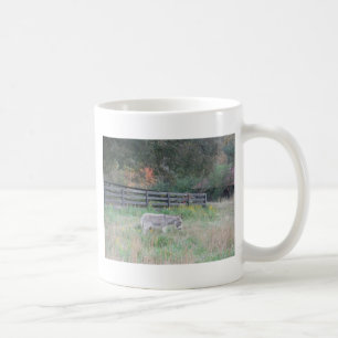 Donkey in a Fall Autumn Field. Coffee Mug