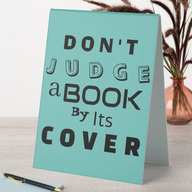 "Don't Judge a Book by Its Cover" Blue Pink Quote (In SItu (Table))