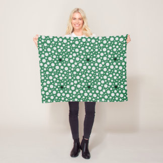 Dot pattern on green fleece blanket