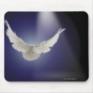 Dove flying through beam of light mouse mat