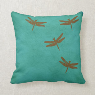 Dragonflies and teal coloured pillow