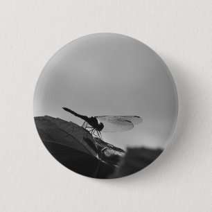 Dragonfly in grayscale on a round button