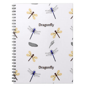 Dragonfly pattern on white notebook