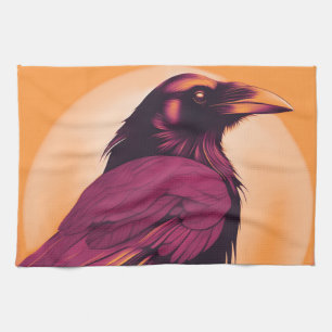 Drawing of a black raven on yellow orange tea towel